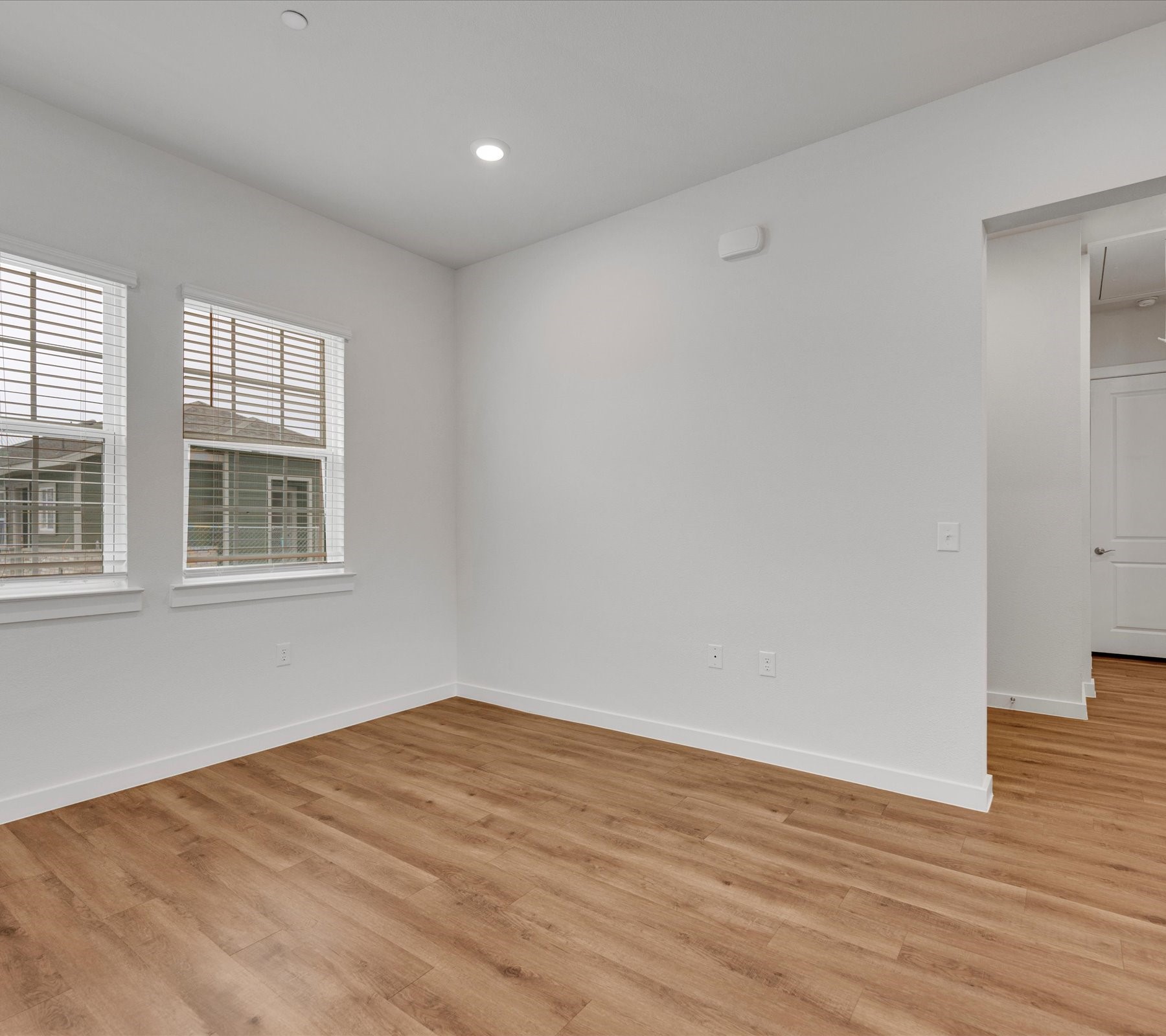 2703-403 Rockhill Road McKinney, TX 75072 - Photo 11 of 18 a view of empty room with wooden floor and fan