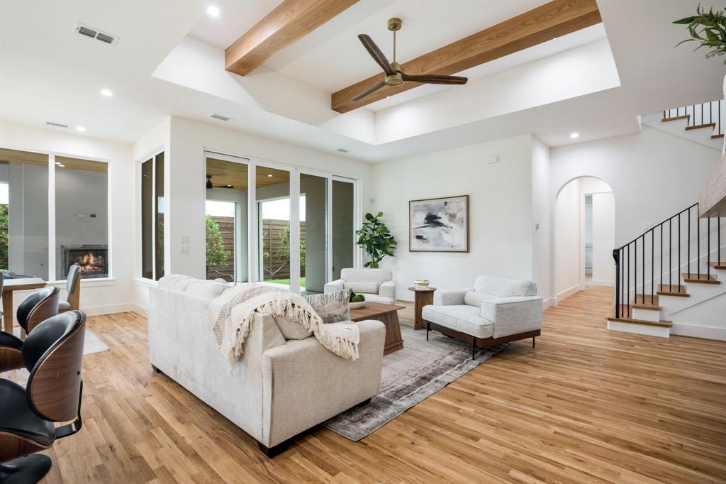 3304 Ferguson Road Grapevine, TX 76092 - Photo 12 of 38 Living area featuring a vaulted ceiling with exposed wood beams and a ceiling fan