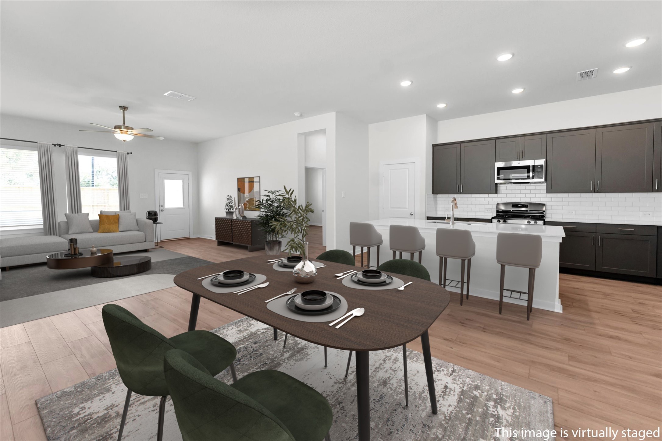 16026 Copper Skies Way Cypress, TX 77429 - Photo 23 of 47 Virtually staged kitchen, dining and family room