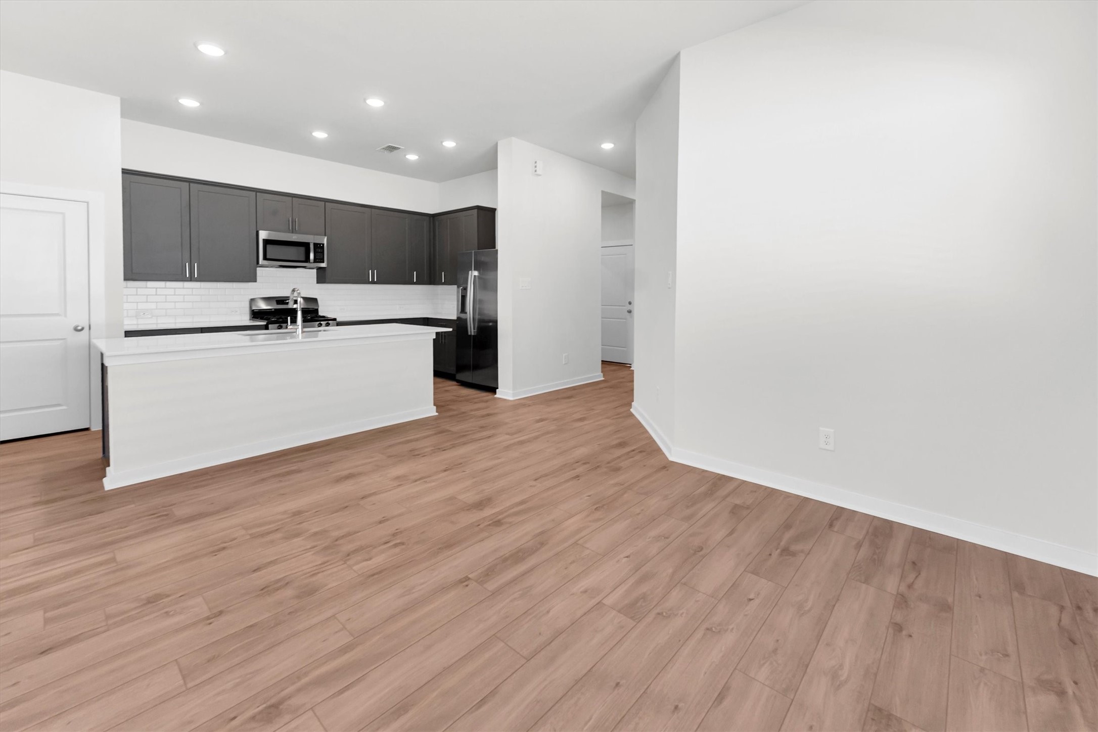 16026 Copper Skies Way Cypress, TX 77429 - Photo 25 of 47 Kitchen, dining and family room