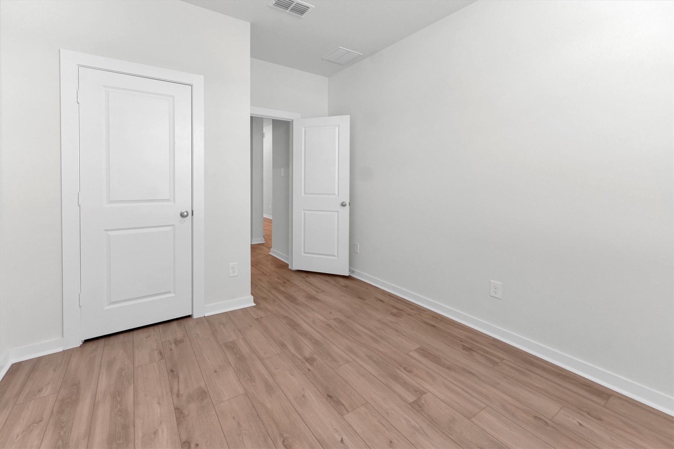 16026 Copper Skies Way Cypress, TX 77429 - Photo 41 of 47 a view of an empty room with wooden floor