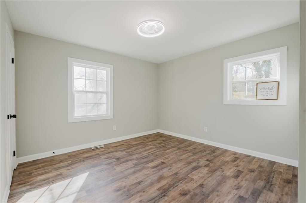 2976 Bay Berry Drive Southwest Marietta, GA 30008 - Photo 12 of 33 an empty room with windows and closet