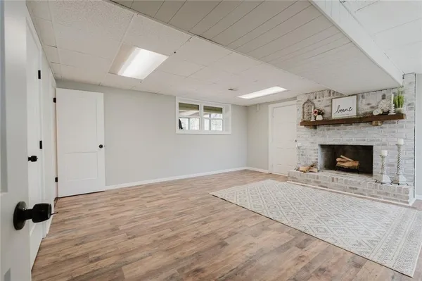 a view of an empty room with a fireplace