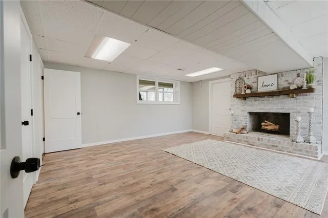 a view of an empty room with a fireplace