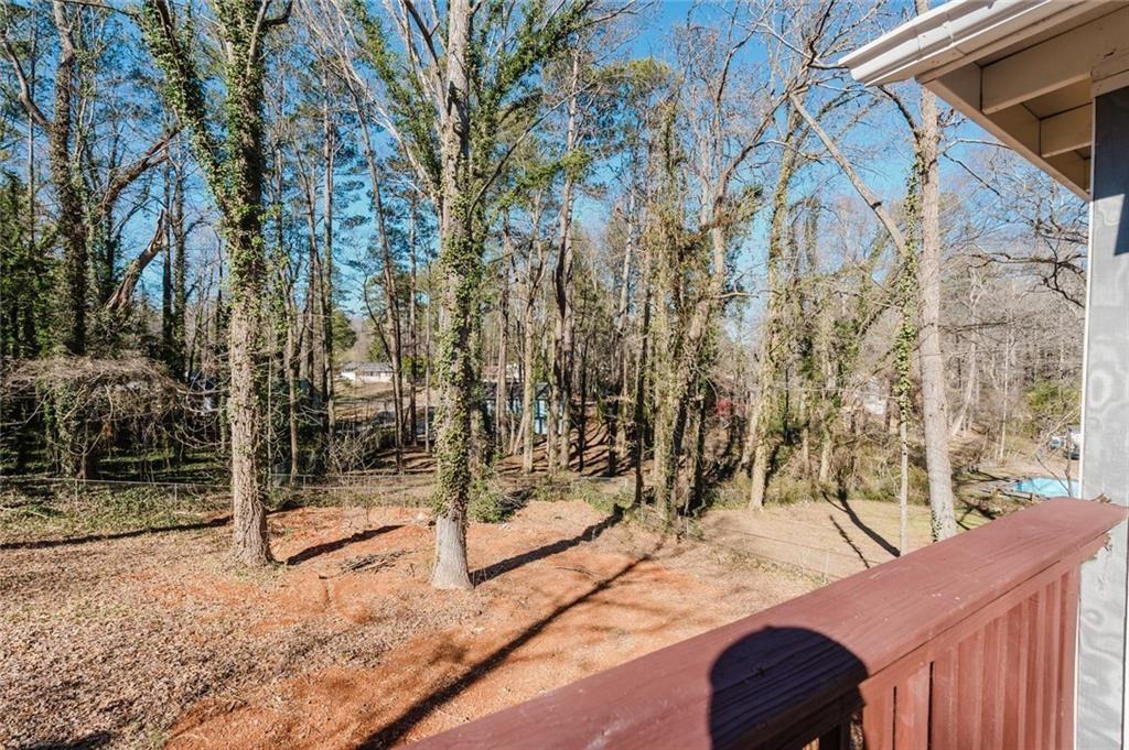 2976 Bay Berry Drive Southwest Marietta, GA 30008 - Photo 26 of 33 a view of a backyard with wooden fence and large trees