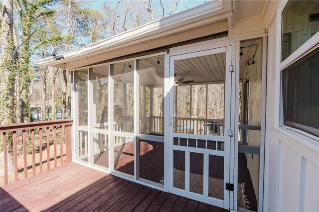 a view of a balcony with wooden floor