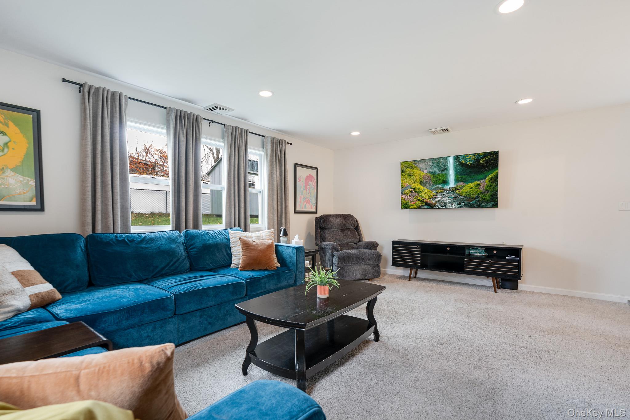 29 Wedgewood Road Fishkill, NY 12524 - Photo 8 of 19 a living room with furniture and a flat screen tv