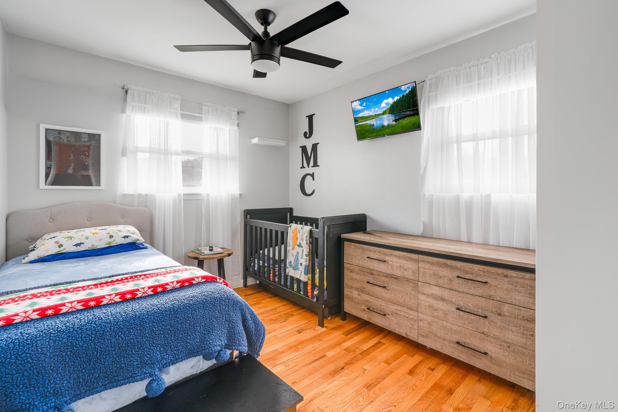 29 Wedgewood Road Fishkill, NY 12524 - Photo 10 of 19 a bedroom with a bed and a flat tv screen on the dresser