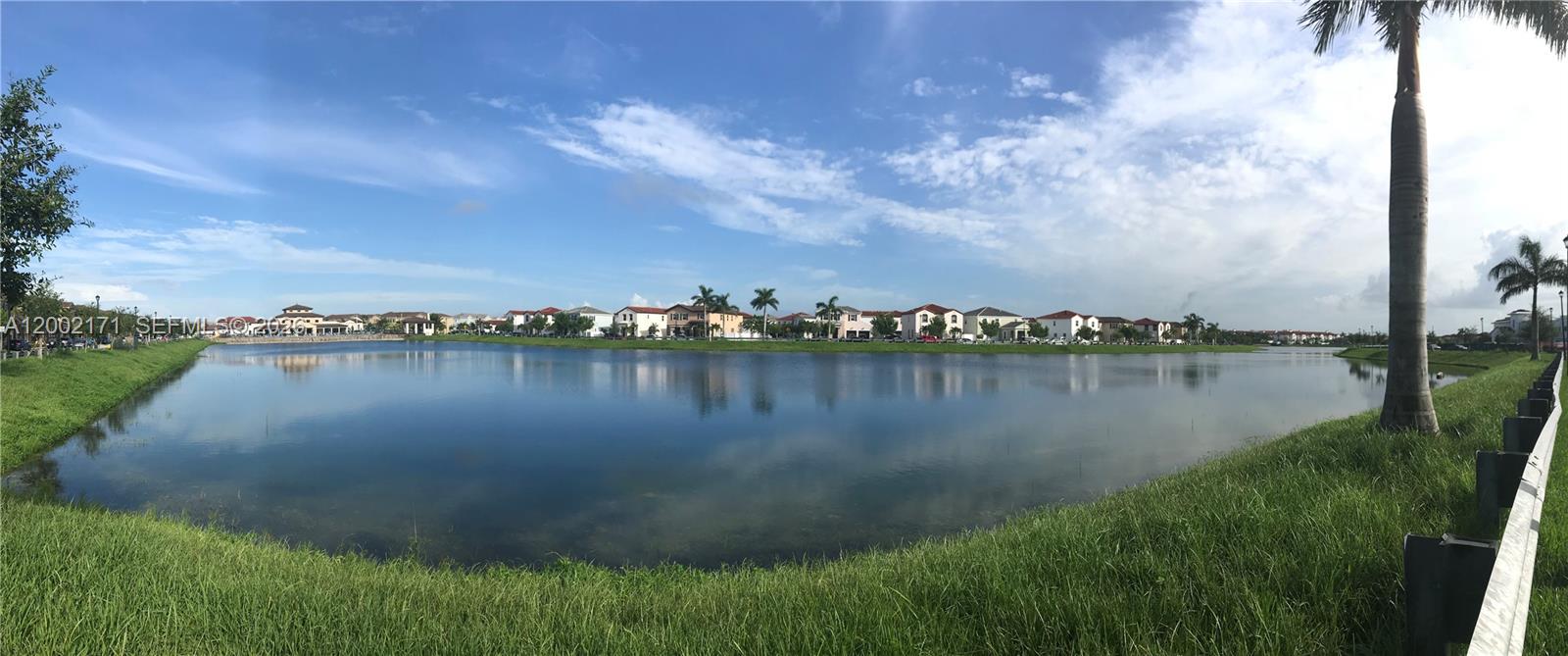 9515 Southwest 171st Place, Unit ANNEX Miami, FL 33196 - Photo 11 of 26 a view of a lake from a yard