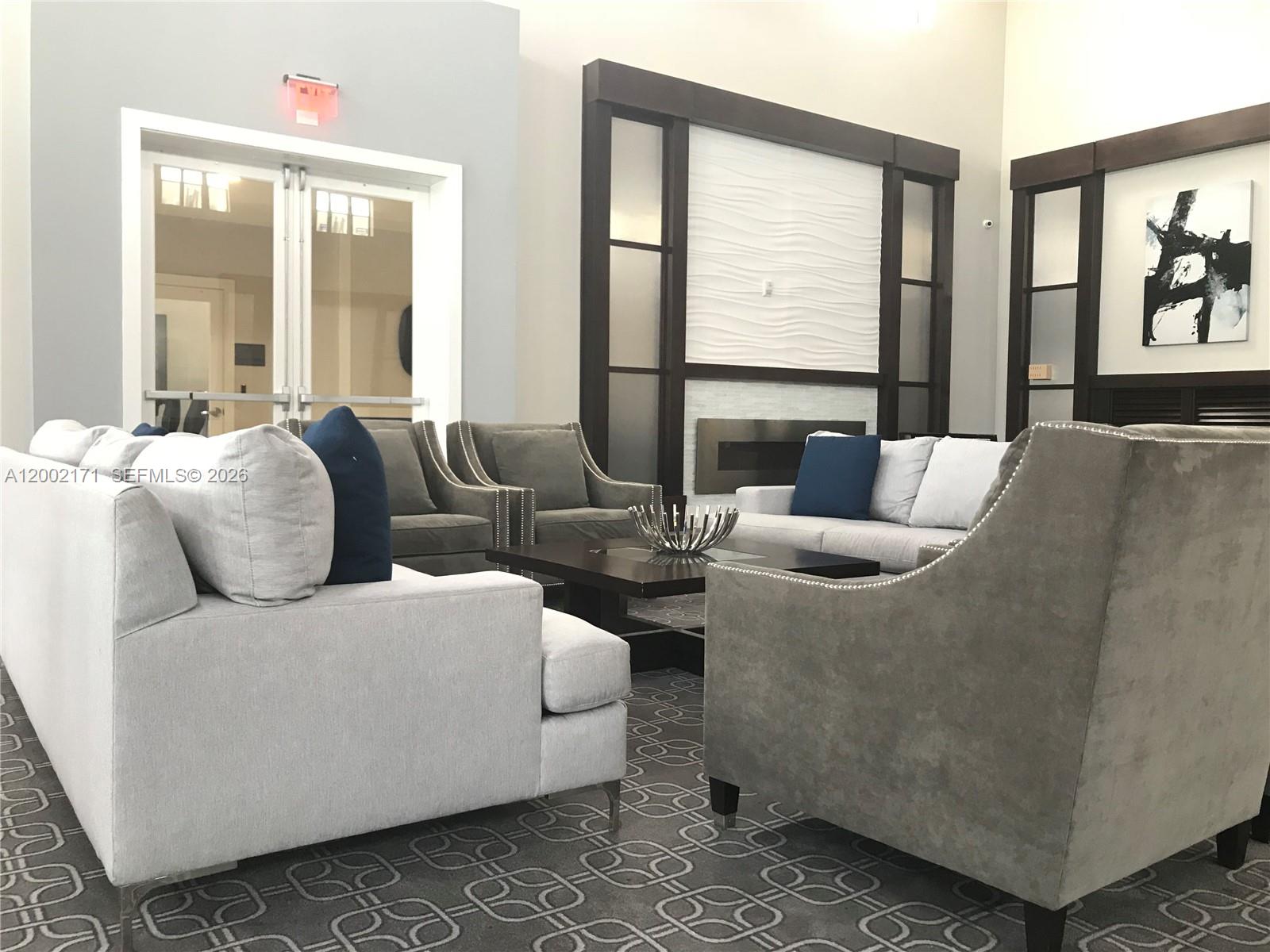 9515 Southwest 171st Place, Unit ANNEX Miami, FL 33196 - Photo 14 of 26 a living room with furniture and large windows