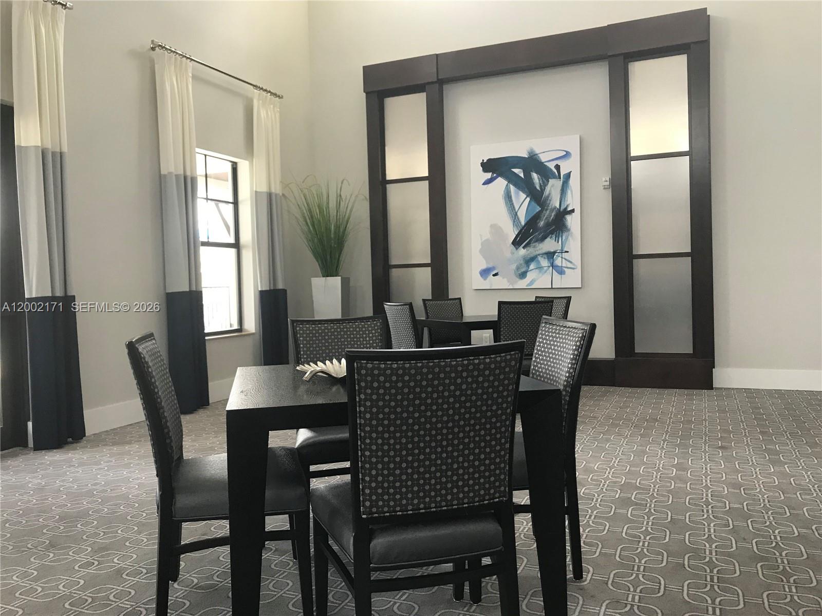 9515 Southwest 171st Place, Unit ANNEX Miami, FL 33196 - Photo 15 of 26 a dining room with furniture and window