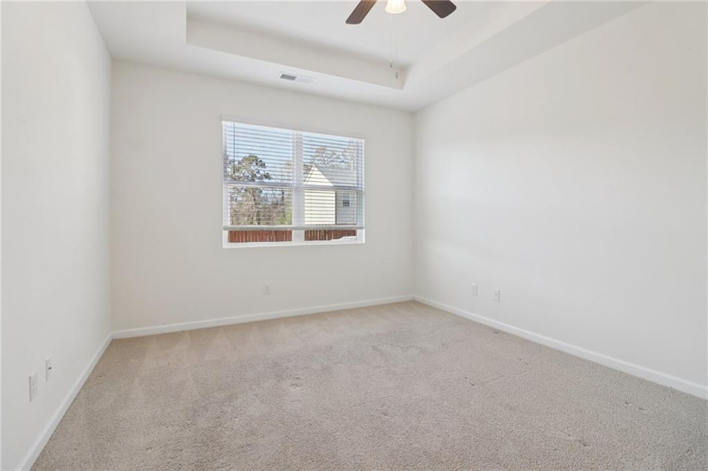 1729 Limousin Way Stockbridge, GA 30281 - Photo 11 of 26 an empty room with windows