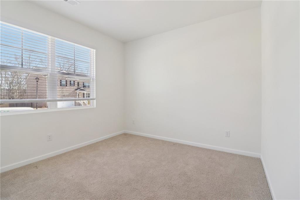 1729 Limousin Way Stockbridge, GA 30281 - Photo 14 of 26 a view of an empty room with a window