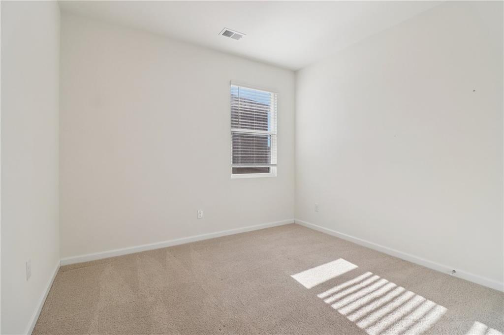 1729 Limousin Way Stockbridge, GA 30281 - Photo 16 of 26 a view of an empty room with a window
