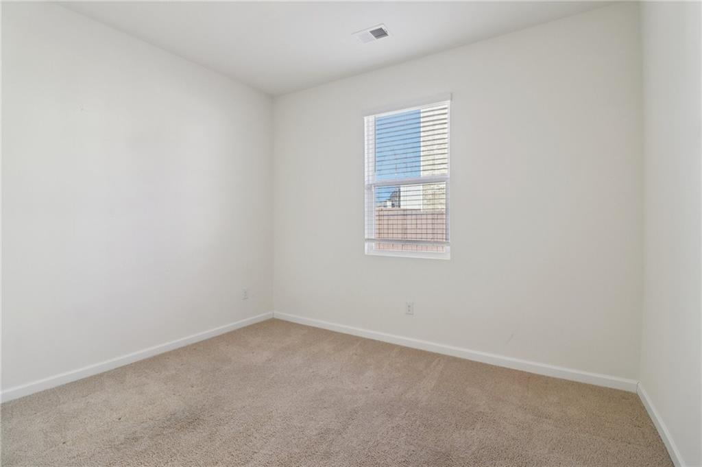 1729 Limousin Way Stockbridge, GA 30281 - Photo 18 of 26 an empty room with a window
