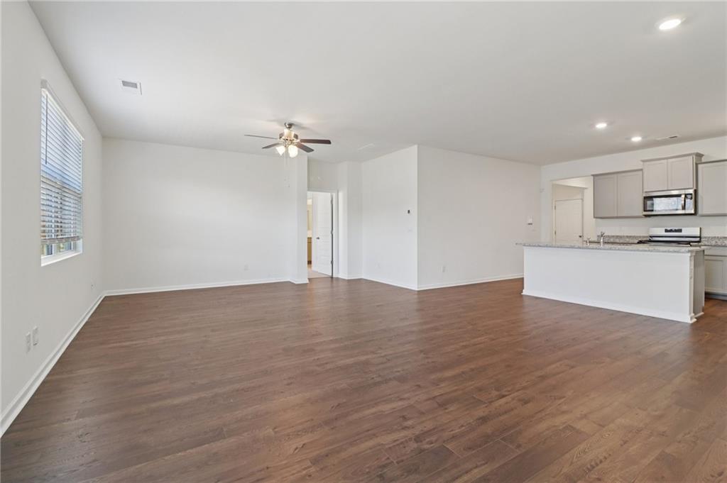 1729 Limousin Way Stockbridge, GA 30281 - Photo 5 of 26 a view of a kitchen with a sink and a refrigerator