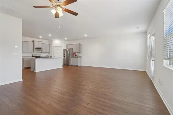 a view of a kitchen with a stove cabinets and wooden floor