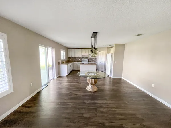 a view of kitchen and dining room with wooden floor