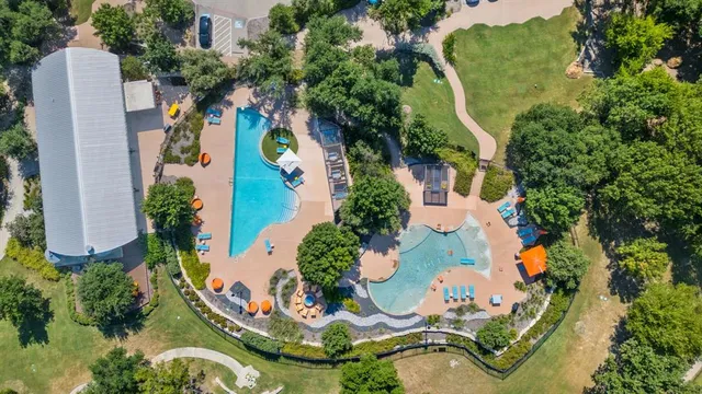 an aerial view of a house with a yard and garden