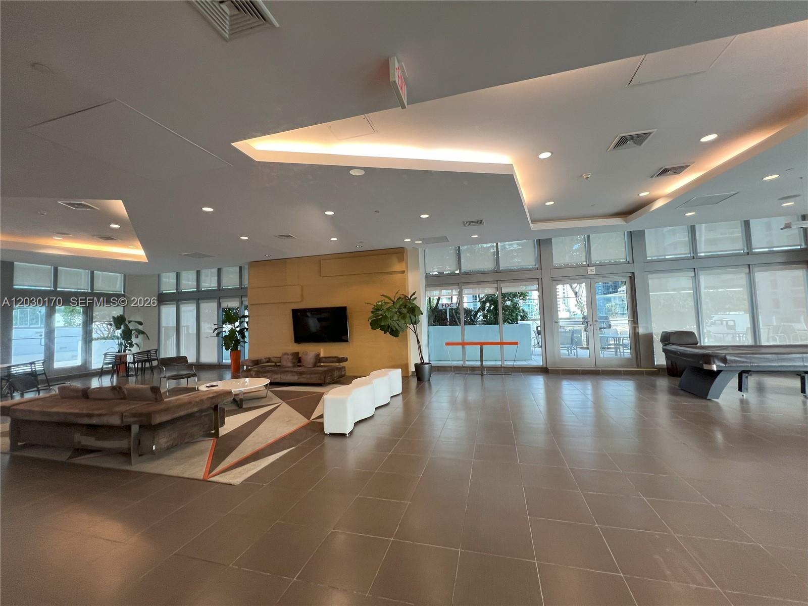 79 Southwest 12th Street, Unit 1710S Miami, FL 33130 - Photo 25 of 25 a lobby with furniture and window