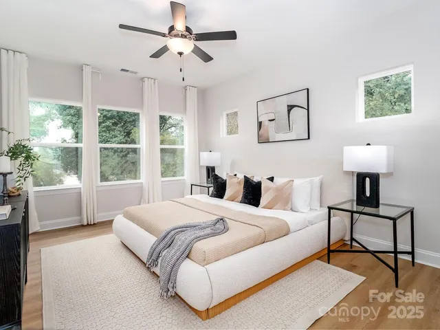 a bedroom with a bed and a lamp on table