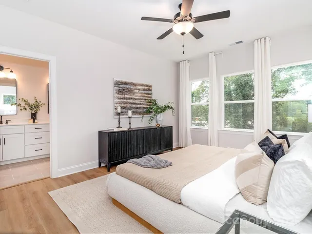 a bathroom with a double vanity sink mirror and shower