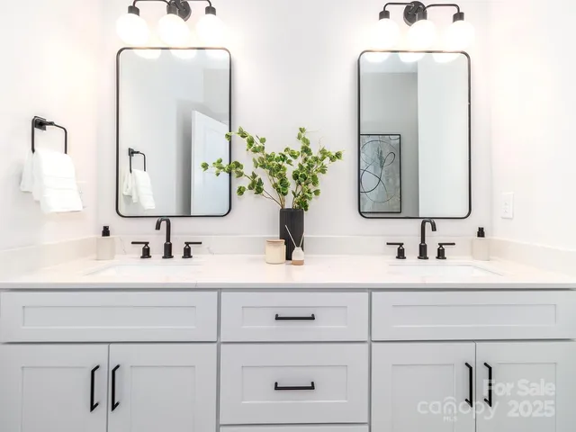 a bathroom with a granite countertop shower