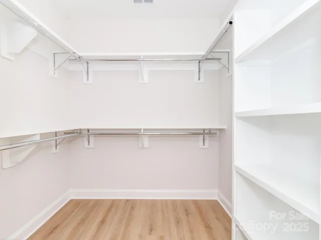 a view of a room with racks on the wall