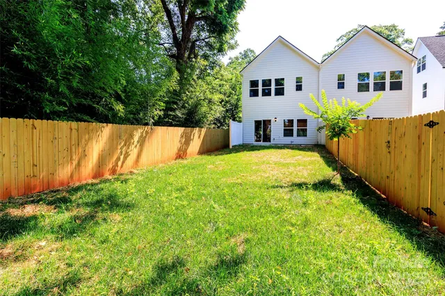 a view of a garden with a small cabin