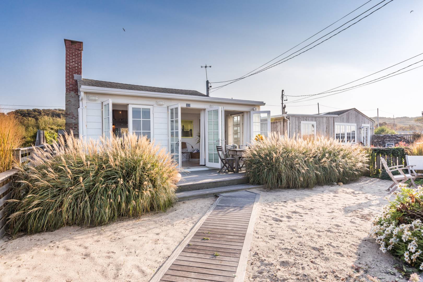 65 Navy Road Montauk, NY 11954 - Photo 1 of 20 a view of a house with a patio