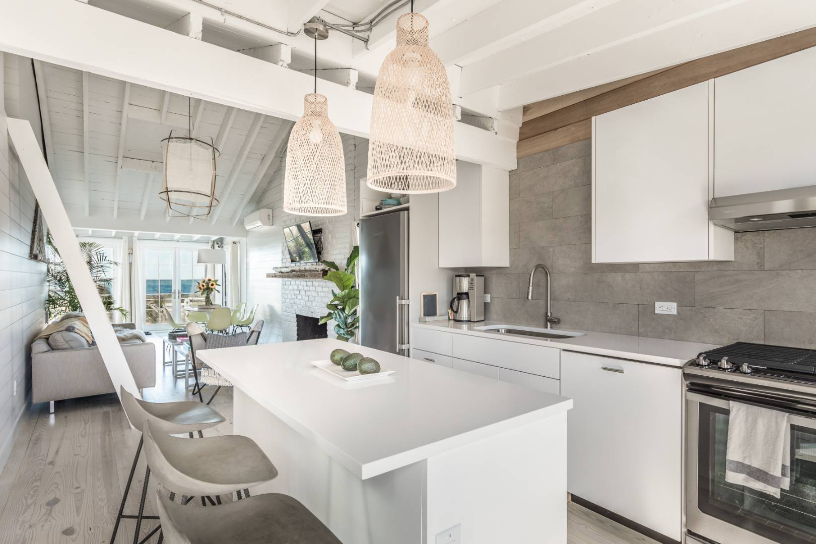 65 Navy Road Montauk, NY 11954 - Photo 7 of 20 a kitchen with a table chairs and a stove