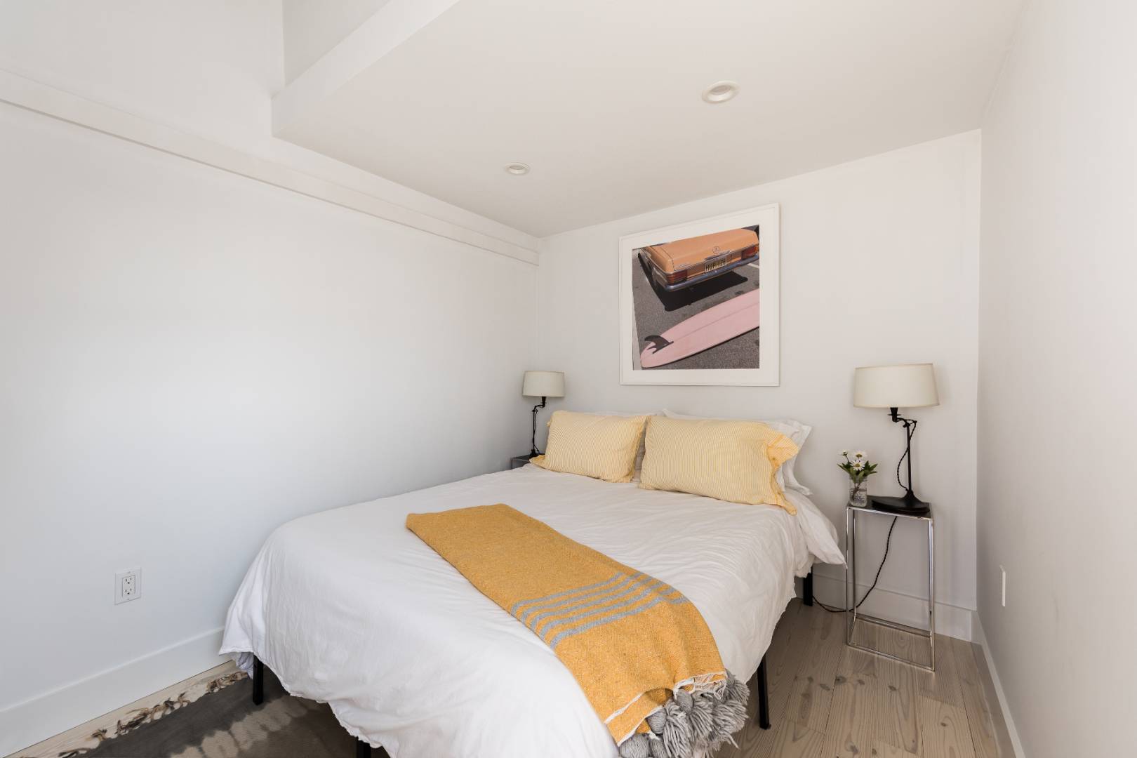 65 Navy Road Montauk, NY 11954 - Photo 10 of 20 a bedroom with a bed and a wall painting