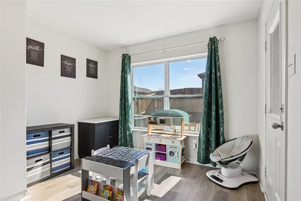 a room with furniture and a large window