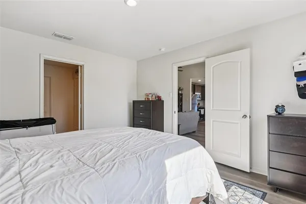 a bedroom with a bed and a closet