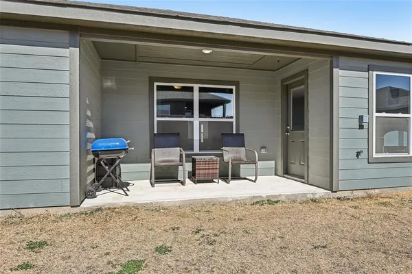 a view of a house with outdoor seating space