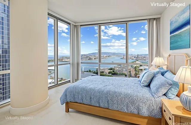 a bedroom with a large bed and a large window