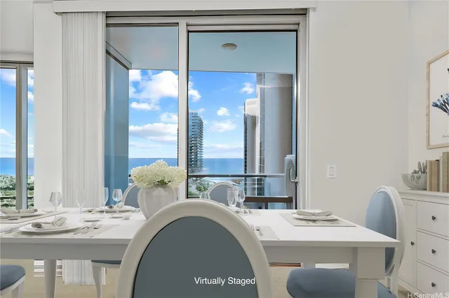 a bathroom with a granite countertop sink a mirror and a bathtub