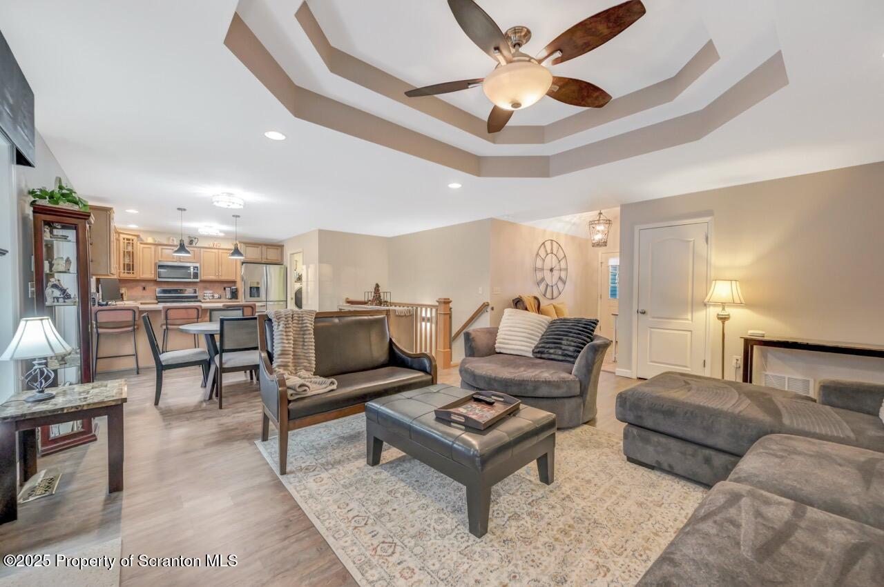 106 Brookview Lane Greentown, PA 18426 - Photo 13 of 59 a living room with furniture a ceiling fan and a rug