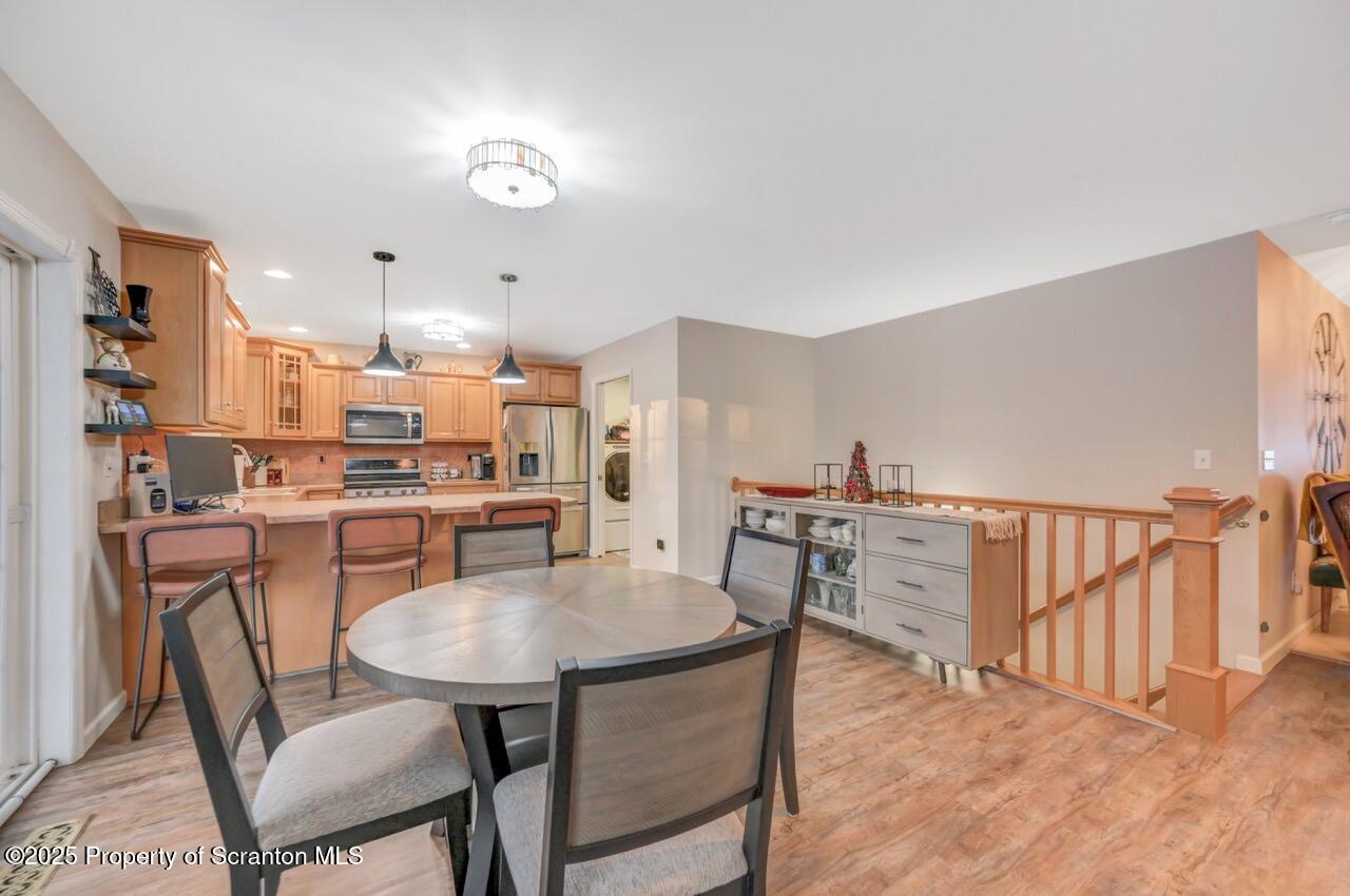 106 Brookview Lane Greentown, PA 18426 - Photo 16 of 59 a dining room with furniture and a kitchen view