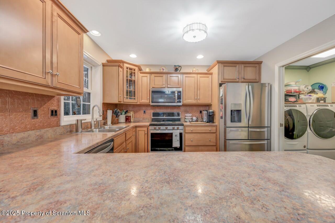 106 Brookview Lane Greentown, PA 18426 - Photo 19 of 59 a kitchen with stainless steel appliances a stove a refrigerator and a sink