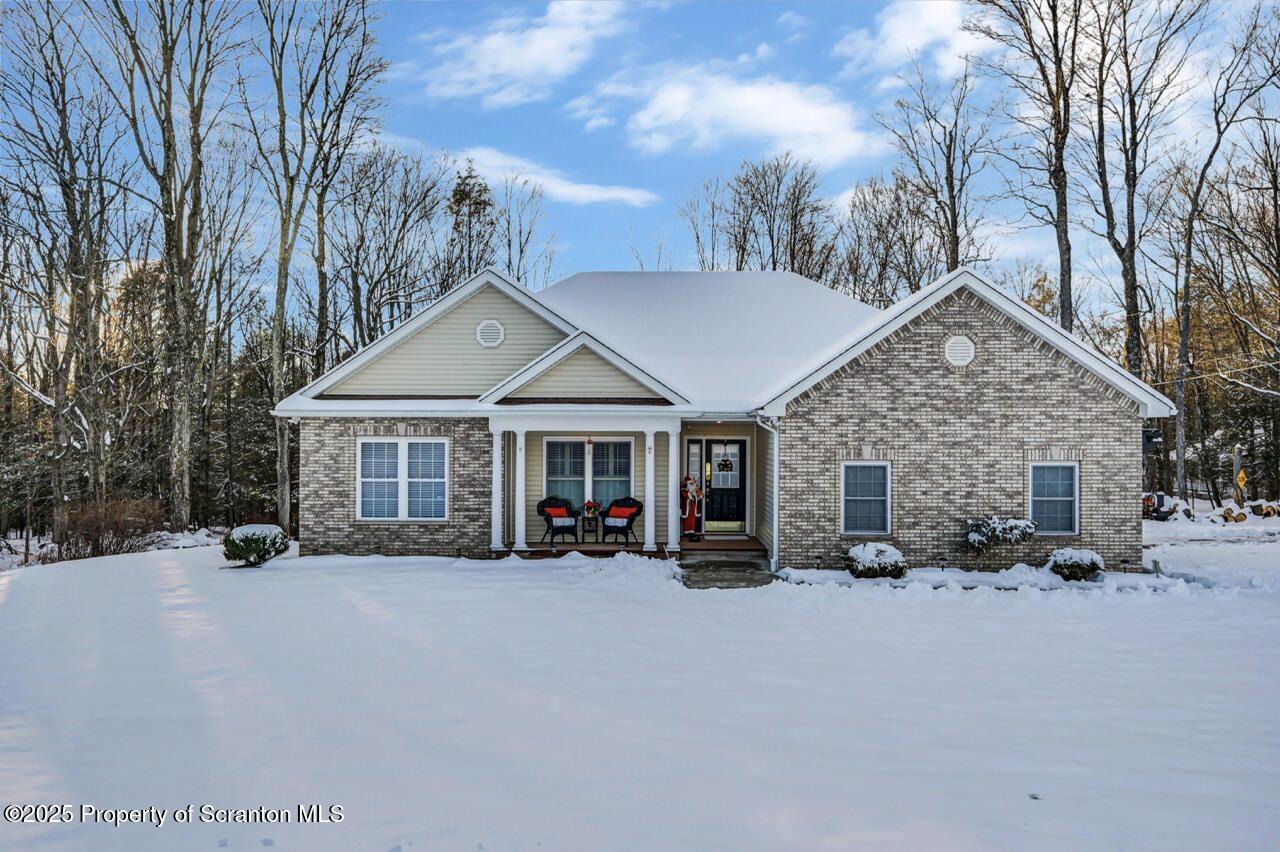 106 Brookview Lane Greentown, PA 18426 - Photo 2 of 59 a view of a house with a yard covered in snow