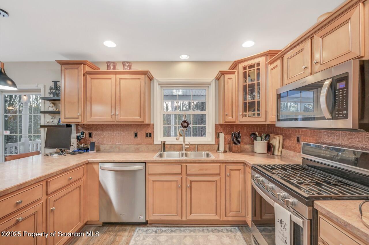 106 Brookview Lane Greentown, PA 18426 - Photo 22 of 59 a kitchen with stainless steel appliances a sink stove and cabinets