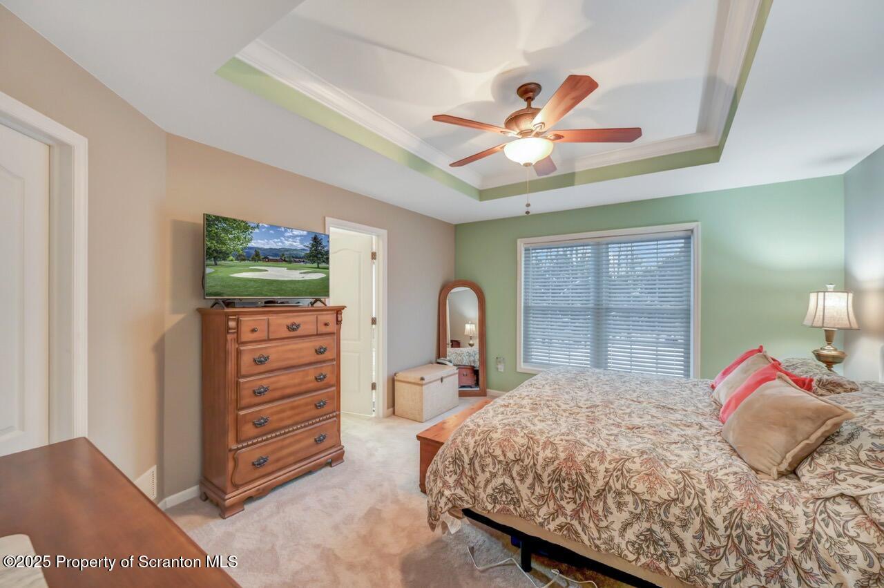 106 Brookview Lane Greentown, PA 18426 - Photo 27 of 59 a bedroom with a bed and a chandelier