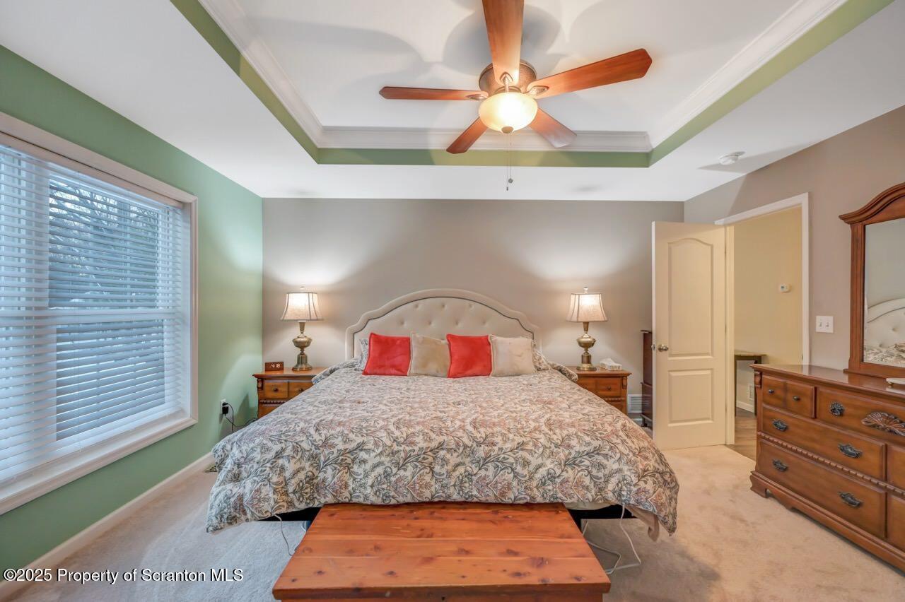 106 Brookview Lane Greentown, PA 18426 - Photo 29 of 59 a bedroom with a bed and a dresser in it