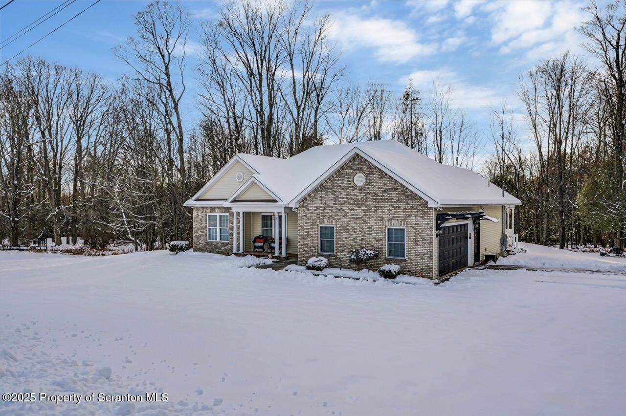 106 Brookview Lane Greentown, PA 18426 - Photo 3 of 59 a view of a house with a big yard and large trees