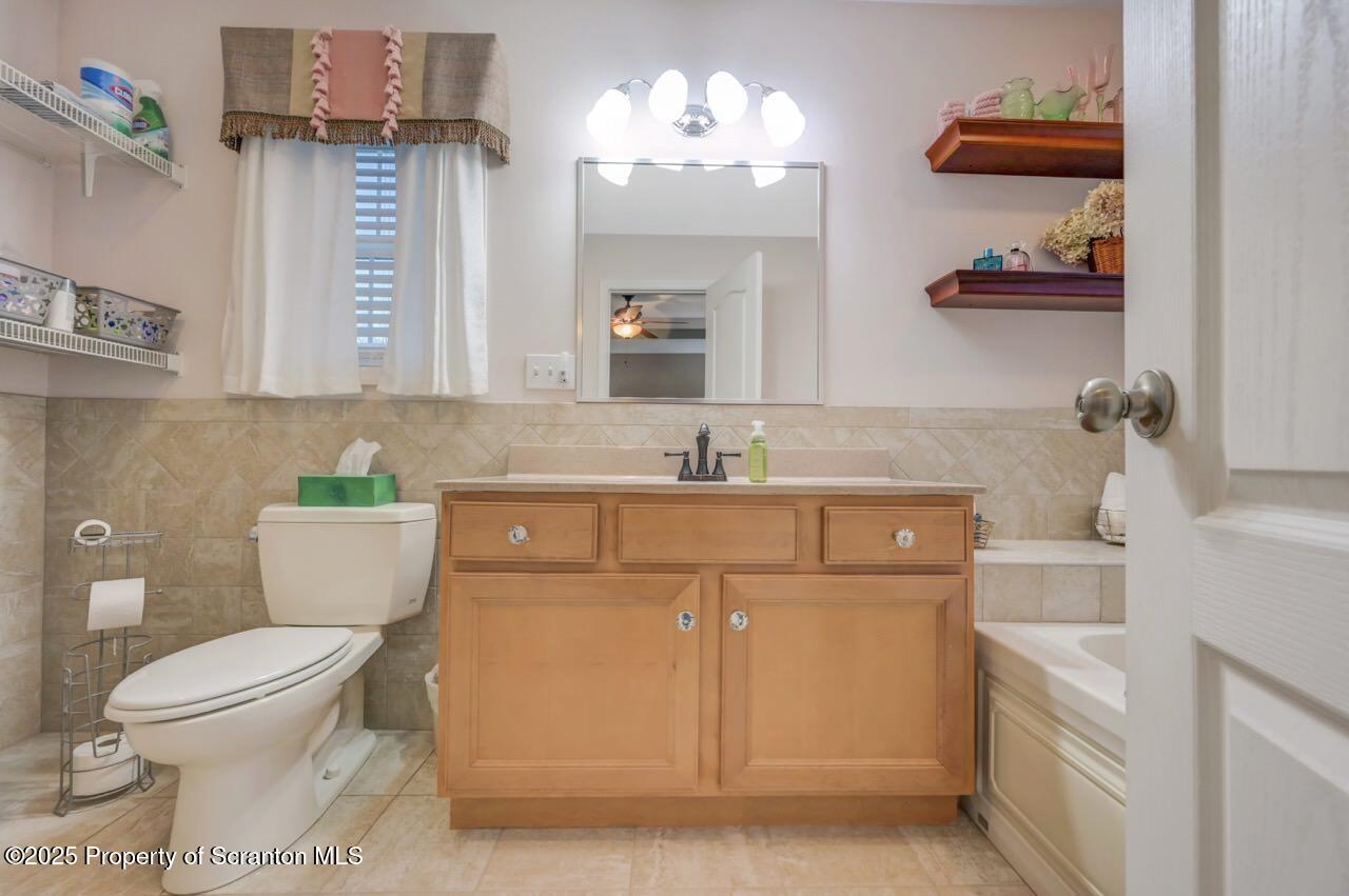 106 Brookview Lane Greentown, PA 18426 - Photo 32 of 59 a bathroom with a sink a toilet and a mirror