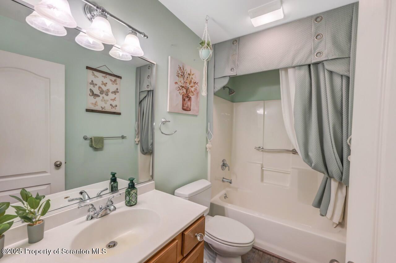106 Brookview Lane Greentown, PA 18426 - Photo 42 of 59 a bathroom with a granite countertop sink a toilet a mirror a vanity and shower