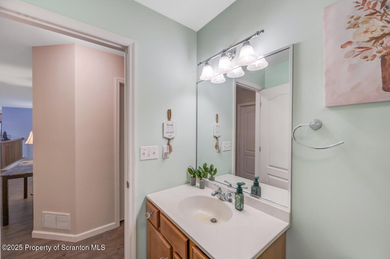 106 Brookview Lane Greentown, PA 18426 - Photo 43 of 59 a bathroom with a sink a light fixture and a mirror