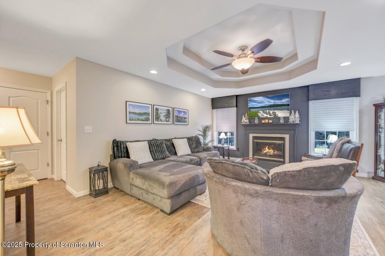 106 Brookview Lane Greentown, PA 18426 - Photo 8 of 59 a living room with furniture a fireplace and a flat screen tv