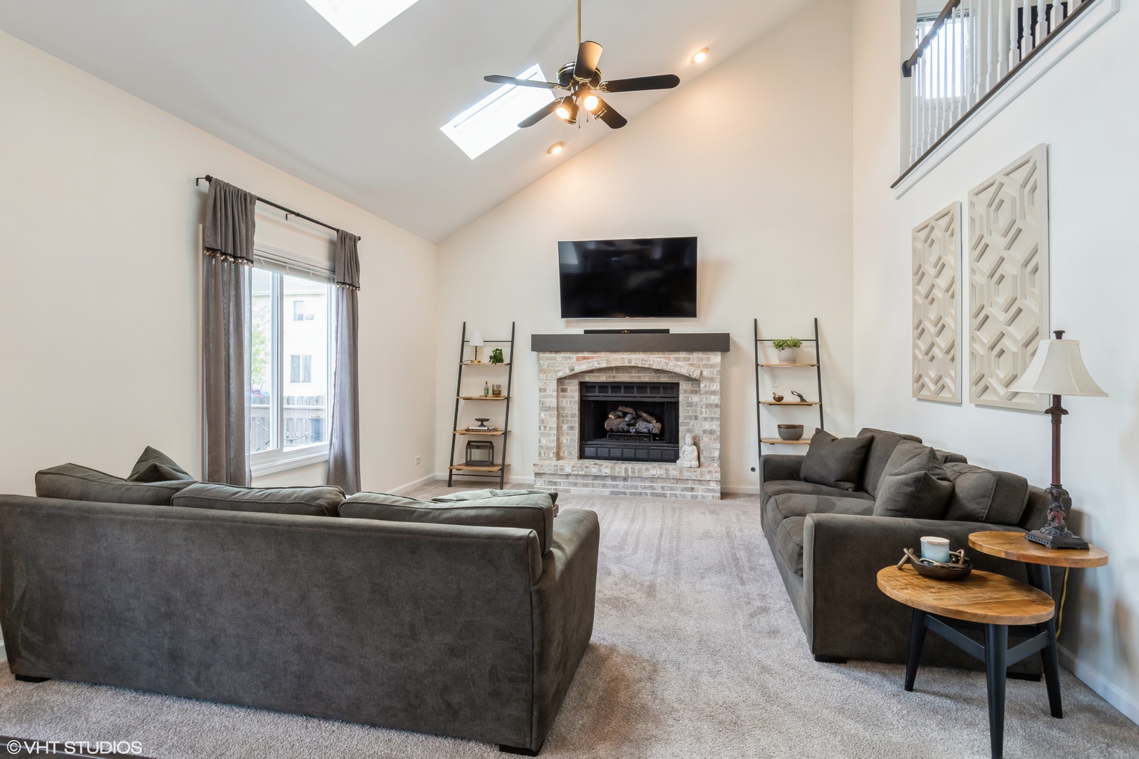 1449 Mesa Drive Bolingbrook, IL 60490 - Photo 12 of 34 a living room with furniture a flat screen tv and a fireplace